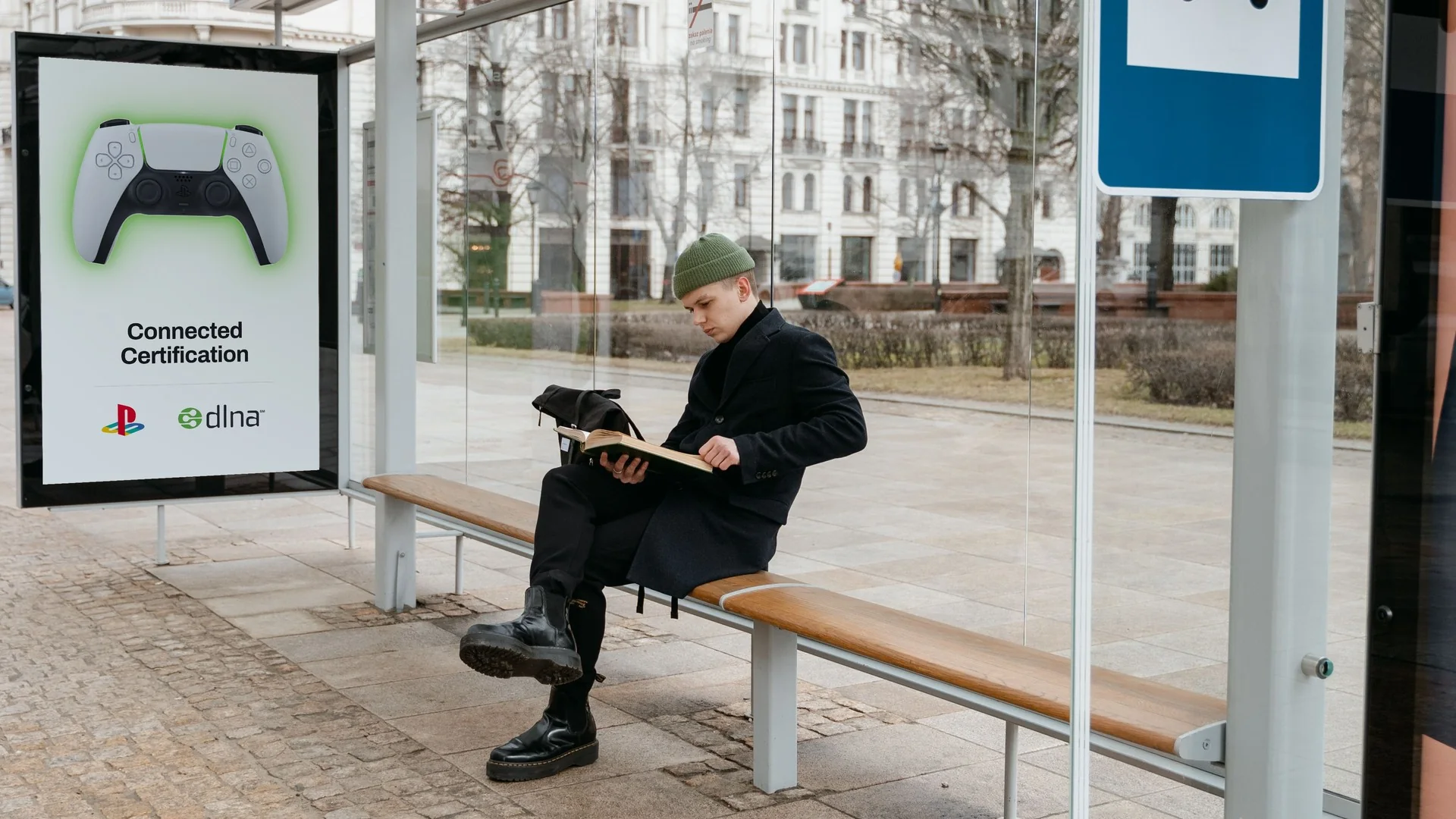 Bus shelter poster: PlayStation controller, Connected Certification, PlayStation and dlna logos