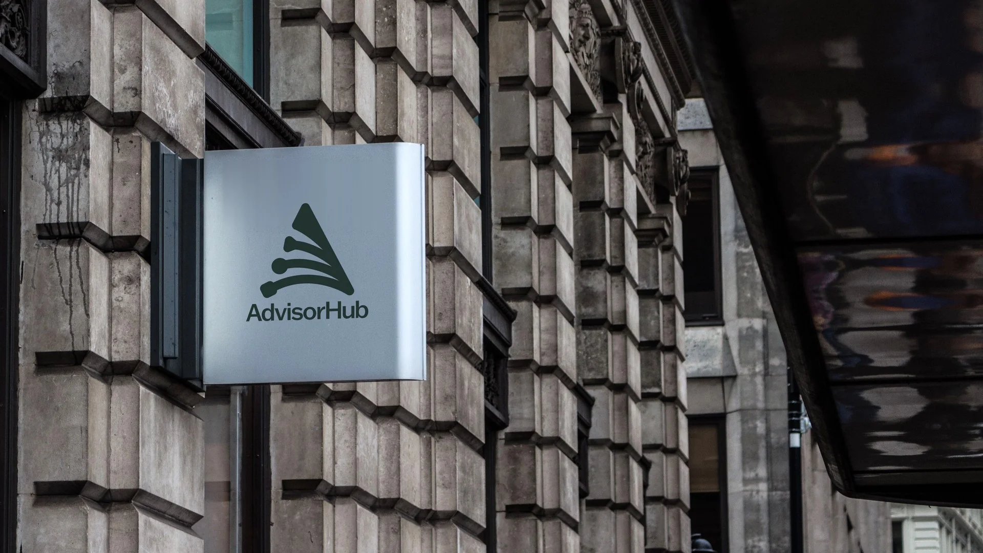 Building sign with the stacked AdvisorHub logo