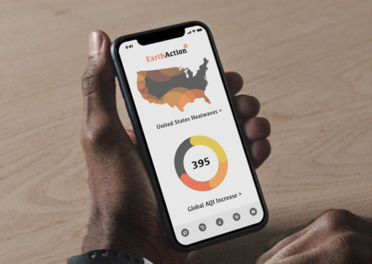 EarthAction mobile app on a phone in hand